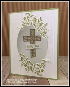 a card with two crosses on it, and the words happy easter written in green