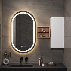 a bathroom with a sink, mirror and shelving unit in the wall above it