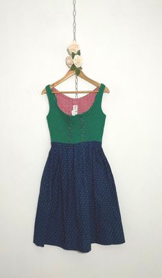 Vintage green and blue floral dirndl dress. The bodice of the dress is a beautiful green and the base is navy with a ditsy green floral pattern. Measurements: Pit to pit: 16.5ins Waist, laid flat: 13.5ins Full length: 43ins Based on the measurements, this dress falls between a UK size 8 and UK size 10. Always refer to measurements before purchasing. Condition: very good #Dirndl #BavarianDress #Cottagecore #Tyrollean #AustrianDress Green Dirndl, Prairie Fashion, Bavarian Dress, Green Floral Pattern, Dirndl Dress, Mode Inspo, Green And Blue, Dress Clothes For Women, Fall Dresses