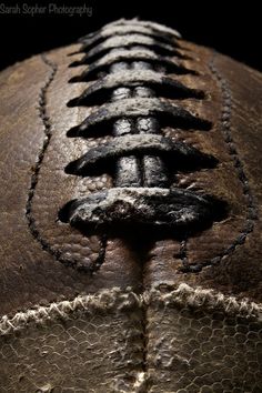 an old baseball that has been stitched together with holes in the middle to make it look like they're bowling