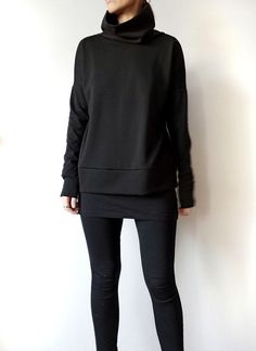 "Minimalist Black Women Sweater, Oversized Women's Heavier Jersey Top with High Collar, Loose Fitting Women Turtleneck Sweatshirt This minimalist black oversized top with a high turtleneck collar and extra long sleeves suits all types of figures. Fabric is a high-quality viscose lycra blend jersey, heavyweight that holds the geometrical shape well. It's a versatile style that can be dressed up or down for all occasions. With no zips, buttons or darts to deal with, this sweatshirt is a super quic Versatile Black Crew Neck Sweater, Black Boxy Fit Sweatshirt For Fall, Oversized Long Sleeve Minimalist Tops, Oversized Plain Top For Layering, Oversized Versatile Sweatshirt, Versatile Oversized Black Tops, Black Drop Shoulder Tops For Fall, Winter Layering Tops With Drop Shoulder, Winter Layering Drop Shoulder Tops