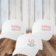 "These pretty pastel birthday hats are a fun choice for you and your birthday squad! Personalize your birthday hats with the design and custom text of your choice.  𝗗𝗘𝗦𝝞𝗚𝝢𝗦 * Hello  (enter any age/number) * Birthday Squad 𝗣𝗘𝗥𝗦𝗢𝗡𝗔𝗟𝗜𝗭𝗘 𝗜𝗧 * Optional: Add 1-2 lines of short custom text to the back 3.00 per hat)  (20 characters per line maximum) * Character limit includes spaces & punctuation * Personalized text comes in lettering style shown: ALL CAPS * No special characters or Cute Cap For Birthday, Fun White Birthday Party Supplies, Fun Curved Brim Hat For Birthday, Adjustable Curved Brim Dad Hat For Birthday, Fun White Party Supplies For Birthday, Cute White Hat For Birthday, Adjustable Dad Hat With Curved Brim For Birthday, Fun Curved Brim Hat For Birthdays, Fun Curved Brim Trucker Hat For Birthday