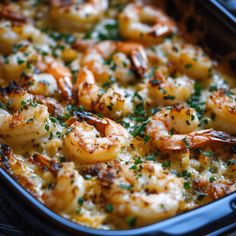 a casserole dish with shrimp and parsley in it, ready to be eaten