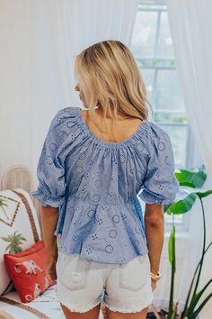 - Turn heads with sweet style with this trendy top! - Unlined eyelet material - An elastic v-cut neckline - Short sleeves with elastic ruffle cuffs - A waistline with an elastic back - A flowy yet flattering silhouette that ends in a ruffled peplum hemline Light Blue Smocked Back Top For Spring, Trendy Blue Top With Smocked Back, Light Blue Smocked Back Top For Summer, Trendy Blue Tops With Ruffle Hem, Fitted Blue Tops With Elastic Waistband, Blue Blouse With Smocked Back For Spring, Spring Puff Sleeve Top With Elastic Waistband, Blue Short Sleeve Tops With Elastic Waistband, Flowy Blue Cotton Tops