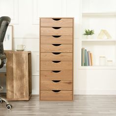 an office with a chair, desk and drawers