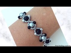 the bracelet is decorated with black and white beads