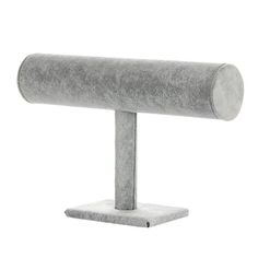 a large gray object on a stand with one arm extended and the other end folded up