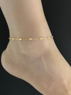 "14K Gold Plated over Sterling Silver Beaded Ankle Bracelet, Minimalist and Dainty Gold Plated over Sterling Silver Anklet ANKLET FEATURES: Metal: All components are made from 14K gold over solid .925 Sterling Silver Model is wearing 9\" in length solid .925 Sterling Silver Rolo Bead Chain Chain Length: 9\" Please send me a message if you have any questions before or after placing your order. Please visit my storefront to view more of my creations: vonzjewel.etsy.com Thanks a lot for stopping by Elegant Adjustable Anklet With Tiny Beads, Minimalist Gold Beaded Anklets, Minimalist Gold Anklet For Wedding, Gold Minimalist Anklet For Wedding, Wedding Anklets, Blue Sapphire Jewelry, Beaded Ankle Bracelets, Beaded Ankle, September Birthstone Jewelry