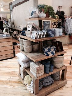 the shelves are filled with baskets and other items in this store's display area