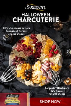 an advertisement for the halloween charcuterie is displayed on a plate with forks and knives