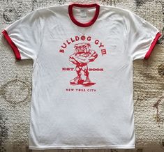 BULLDOG GYM New York City Short Sleeved Ringer T-shirt. Brand New without tag. Sizes Available: Medium, Large and Extra Large. 100% Cotton. Old School Bodybuilding, New York City Vintage, Sports Tshirt Designs, Fun Shirts, Gym Tees, Bodybuilding Workout, Old Logo, City Shorts, Athletic Club