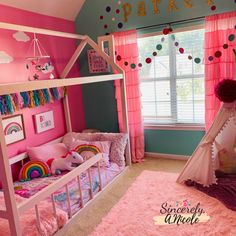 a child's bedroom decorated in pink and blue