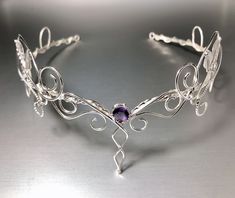 I've hand-forged an alternative bridal tiara featuring elegant scrolling of sterling silver heavy gauged wires. The loops wrap their way around this beautiful, gracefully feminine, and sturdy circlet. I designed it to be multi-layered with twists of vine and leaf work. Each piece and part of this crown is designed, by hand. Each leaf hand-drawn and forged along with the curliques and scrollwork of ivy vine work. This comes with an 8mm round genuine cabochon, or faceted, of your choosing, in the Wedding Circlet, Elvish Wedding, Bridal Circlet, Bijoux Art Nouveau, Silver Tiara, Chique Outfits, Fantasy Wedding, Magical Jewelry, Wedding Tiara