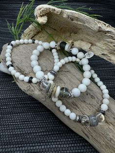 Embrace the calm elegance of the Timeless Serenity Bracelet Set by JP Designs. This handcrafted set combines Matte Ivory Jade beads with uniquely textured Recycled Glass and stunning Lampwork Beads. The addition of Crystal Quartz and luminous Cornflake Pearls creates a perfect harmony of rustic charm and refined elegance. Silver accents add a touch of sophistication, making this set a versatile choice for any style. Perfect for layering or wearing individually, these bracelets offer an effortles Elegant Beaded Crystal Bracelet For Meditation, White Beaded Crystal Bracelet For Meditation, Elegant White Crystal Bracelet For Healing, White Elegant Crystal Bracelet With Natural Stones, Elegant White Crystal Bracelet With Natural Stones, Bohemian White Crystal Bracelet With Natural Stones, Elegant Beaded Bracelets With Natural Stones And Czech Glass, Elegant Bracelets With Czech Glass And Natural Stones, White Beaded Agate Bracelets