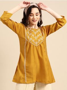 HAND CRAFTED TUNIC DESCRIPTION *Mustard Yellow Embroidered Longline Top Embroidered Short Kurti / Indian Tunic / Summer-Spring Evening Dress Boho Tunic / Hippie Dress / Tribal Print Top * Mustard yellow longline a-line top * Ethnic motifs embroidered * Round neck, three-quarter, regular sleeves * Woven *Fabric:- Rayon  *Wash Care:- Hand Wash AVAILABLE IN 6 SIZES THEY ARE IN FOLLOWING MEASUREMENTS XS:- Bust-34/Waist-26/Length-30 S:- Bust-36/Waist-28/Length-30 M:- Bust-38/Waist-30/Length-30 L:- Bu Boho Yellow, Indian Tunic, Short Kurti, Boho Tunics, Hippie Dresses, Womens Tops Summer, Womens Tunics, Embroidered Top, Boho Tops