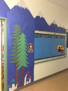 a school hallway decorated with mountains and trees