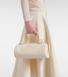 Edith leather shoulder bag in white - The Row | Mytheresa Timeless Beige Shoulder Bag With Handle Drop, White Calf Leather Satchel Shoulder Bag, White Calf Leather Shoulder Bag With Soft Leather, Timeless Beige Calf Leather Satchel, Beige Calf Leather Satchel With Top Carry Handle, White Calf Leather Shoulder Bag With Removable Pouch, Beige Calf Leather Satchel With Top Handle, White Calf Leather Shoulder Bag With Double Handle, Beige Calf Leather Satchel With Detachable Handle