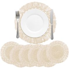 a table setting with place mats and silverware