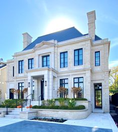 a large white house with lots of windows