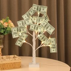 the money tree is decorated with lights