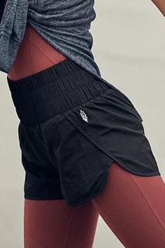 Speed up or slow down in these breezy, warm-up style running shorts, featuring a boldly smocked waistband with a high-rise silhouette and split hem. Pull-on style Stretch waistband Relaxed fit FP Movement Care/Import Machine Wash Cold Measurements for size small Hips: 43 in Inseam: 2 in Rise: 12.25 in Waist: 26 in Nylon Shorts With Elastic Waistband, Stretch Athletic Shorts With Elastic Side Panels, Stretch Athletic Shorts With Elastic Side Panels For Gym, Athleisure Shorts With Elastic Side Panels For Workout, Athleisure Workout Shorts With Elastic Side Panels, Workout Shorts With Elastic Side Panels, Workout Activewear With Elastic Side Panels, Sporty Elastic Nylon Shorts, Nylon High-waisted Shorts With Elastic Waistband