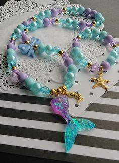 "Mermaid inspired necklace bracelet set, kids beaded set, jewelry set, childrens jewelry, starfish bracelet, kids necklace, party favor. \"Mermaid Kisses and Starfish Wishes\" DETAILS and MEASUREMENT: Necklace: 20\" Bracelet: 6.5\" Made on stretchy cord. We can also put a clasp on it, for an extra $3.50 PLEASE NOTE: due to the high volume of orders, it is impossible for us to keep the same beads for all our orders, so the beads on your order may differ from the ones shown in the photo. if you wo Mermaid Bracelet Diy, Big Sister Necklace, Blue Snacks, Team Bracelets, Festival Clothes, Mermaid Crafts, Mermaid Kisses, Mermaid Bracelet, Starfish Bracelet