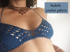 there is a woman wearing a blue bralet with crocheted details on it