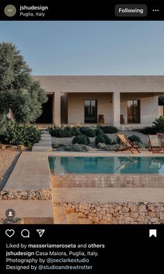 an image of a house with a pool in the front yard and landscaping around it