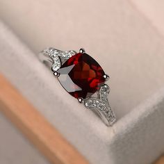 This ring features a 8*8mm cushion cut natural garnet and sterling silver finished with rhodium. Customization is available. It is made by hand, and it will take about 7 days to finish the ring after your payment is completed. Main stone: natural garnet Morganite weight: Approx2.71 ct Nontraditional Engagement Rings, Vintage Anniversary Rings, Red Gemstone Ring, January Birthstone Rings, Garnet Engagement Ring, Red Garnet Ring, Gold Chain Design, Ring Cushion, Cushion Cut Ring