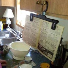 an open book sitting on top of a kitchen counter