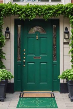 a green front door surrounded by potted plants