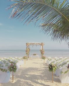 an outdoor wedding setup on the beach