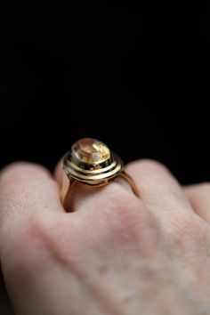 14k gold oval yellow golden citrine ring stamped 585. The bezel has two layered steps and the shank is tapered with a defining line.  6 grams size: 10.25 Stone size: 18mm x 10mm Bezel size: 24mm x 17mm RESIZING AVAILABLE : 👋🏽 I charge an additional $50 if you are interested in having this ring resized. There is a 2 week (or less) turn around time. Please go to this listing https://www.etsy.com/ca/listing/1068711810/ring-sizing-available?ref=shop_home_active_4&frs=1 and add your size to the car Yellow Gold Oval Cabochon Dome Ring For Anniversary, Gold Oval Dome Ring With Gemstone, Gold Dome Ring With Oval Cabochon For Wedding, Antique Oval Dome Ring For Anniversary, Gold Oval Cabochon Dome Ring For Wedding, Heirloom Style Gold Oval Dome Ring, Oval Gemstone Dome Ring In Yellow Gold, Antique Oval Yellow Gold Rings, Oval Gold Topaz Ring Stamped 14k