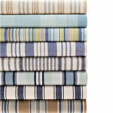 six striped towels stacked on top of each other in blue, green and white colors