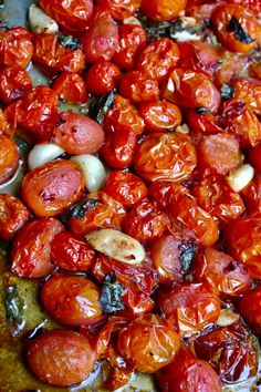 a pizza with tomatoes and mushrooms on it