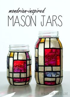 two mason jars with colorful stained glass in them and the words, modern - inspired mason jars