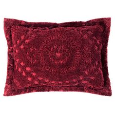 a red decorative pillow on a white background