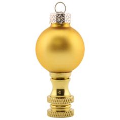 a gold christmas ornament on a white background