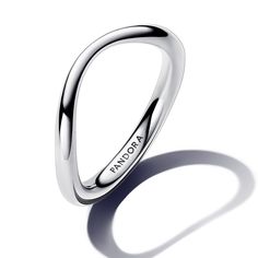 From Pandora, choose sleek simplicity when you wear the Organically Shaped Band Ring. Crafted of sterling silver, this polished ring band features an organic look, varying in thickness for an undulating effect. A playful reimagining of a standard linear silhouette, this ring's curves make it a fresh addition to your favorite stack. Use it as an accent piece to pair with different metal tones, stones and colors, or stack similar simple styles for a sleek result. Pandora Style #: 193314C00-52 Silver Jewelry Pandora, Pandora Silver Rings, Dainty Silver Rings, Pandora Stackable Rings, Pandora Essence, Pandora Rings, Pandora Style, Pandora Silver, Silver Band Ring