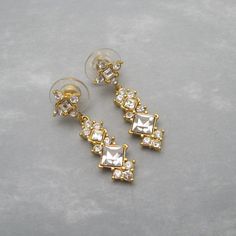 Long Rhinestone Earrings Dangly Vintage Jewelry Gold Jeweled Cubic Zirconia Earrings, Gold Rhinestone Crystal Earrings, Diamond-shaped Gold Earrings For Wedding, Gold Cubic Zirconia Jeweled Bridal Earrings, Formal Metal Crystal Earrings, Dazzling Gold Crystal Earrings, Gold Cubic Zirconia Crystal Earrings With Bling, Gold Diamond Crystal Earrings For Evening, Gold Jeweled Crystal Earrings With Cubic Zirconia