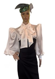 PRODUCT DETAILS  - Semi- fitted blouse. - Satin top with oversized spread collar. - Long ( 25 inch - 63.5 cm Long without cuffs) puffy sleeves gathered at shoulder and cuff sleeves.  -  Button- fastening cuffs - 3.5 inch/9 cm wide ( with 2 satin covered buttons for each cuff) - Centre-front button fastening with satin covered buttons. - Self Neck Tie 6 inches/ 15 cm wide and 67 inch/ 170 cm long  - Shirt Length, measured from shoulder height to hem - 27 inch ( 68cm). - Shirttail hem. - Fabric- Satin Polyeste. Machine wash. Line dry.   Only basic body measurements are needed to your pattern type and size. Remember to wear proper undergarments and shoes when measuring. Also, make sure the tape measure is held snugly and firmly (not tightly) against your body and is always parallel to the flo Elegant Long Sleeve Stretch Blouse, Fitted Evening Tops With Blouson Sleeves, Fitted Tops With Blouson Sleeves For Evening, Elegant Fitted Blouse With Blouson Sleeves, Chic Fitted Puff Sleeve Blouse, Chic Fitted Blouse With Puff Sleeves, Fitted Blouse With Blouson Sleeves For Evening, Classic Fitted Shirt With Puff Sleeves, Fitted Blouson Sleeve Party Tops