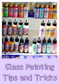 a shelf filled with lots of different types of paint and glues on top of each other