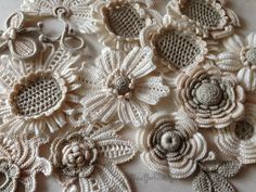 crocheted flowers are arranged on the table