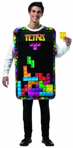 a man is holding up a giant tetris board costume that says tetris