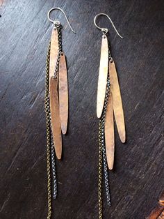 "These are hammered and oxidized brass with sterling and brass chain. They are super long, very swingy and shimmery, light and free, still edgy and mysterious...and very rock and roll. 6 1/2\" long (including earwire) sterling eawires They could definitely be made shorter, just let me know..." Metal Feather, Lure Making, Mixed Metal Jewelry, Sweet Lady, Handmade Ideas, How To Make Shorts, Feather Earrings, Brass Chain, Flower Jewellery