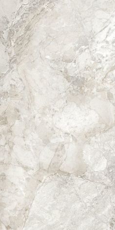 a white marble textured surface with grey veiners