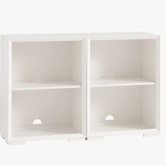 two white bookshelves with holes in the middle and one open on each side