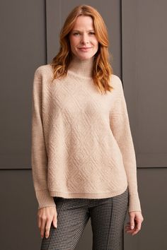 We're falling hard for this mock neck sweater this season, and you'll instantly see (and feel) why. We can't get enough of the pop-over design, long sleeves with drop shoulders, high-low hem, and the textured fabric showcasing an elegant diamond pattern that adds a soft and stylish finish. Style: 1528O-3590-0052 Beige Funnel Neck Sweater For Winter, Beige Turtleneck Sweater For Layering, Cream Turtleneck For Fall, Beige Turtleneck Sweater For Fall, Beige High Neck Sweater For Layering, Beige High Neck Sweater For Fall, Neutral Fall Sweater With Ribbed Cuffs, Cream Turtleneck Sweater For Fall, Neutral Tops For Winter Layering