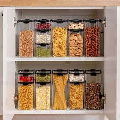 an organized pantry with cereal, pasta and other foods in plastic containers on the shelves