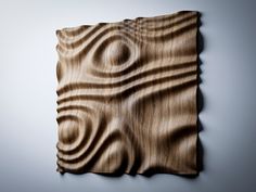 a piece of wood that has been carved into the shape of a spiral on it